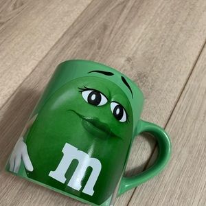 Green M & M’s Coffee Mug. Very Good Condition. No chips or cracks.  4” H